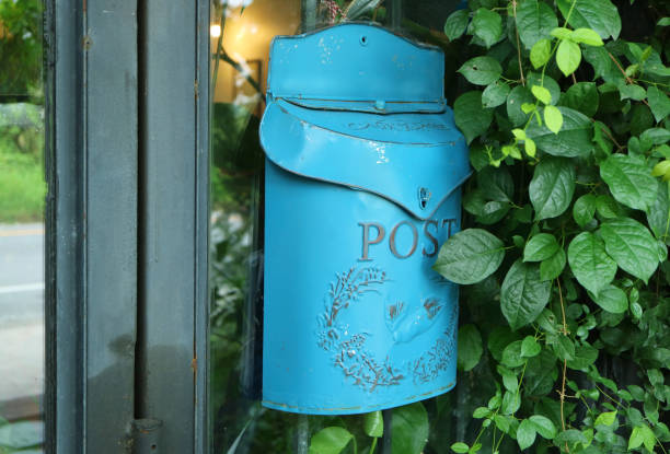 Sky Blue Postbox on Room's Glassed Outside Wall