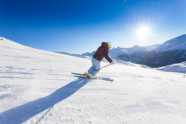 istock Female Skier in Action and Mountain View 174849208