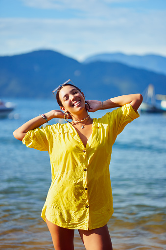 portrait Latin American young woman happy enjoying the beach and sun