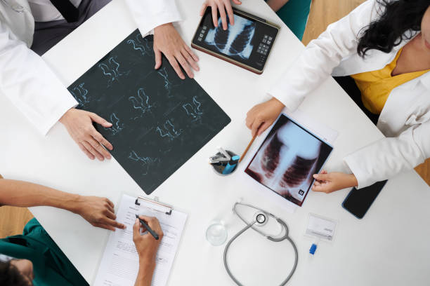istock Doctors Discussing X-ray Images 1748492394