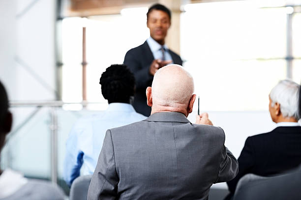 istock Businesspeople attending a conference 174849324