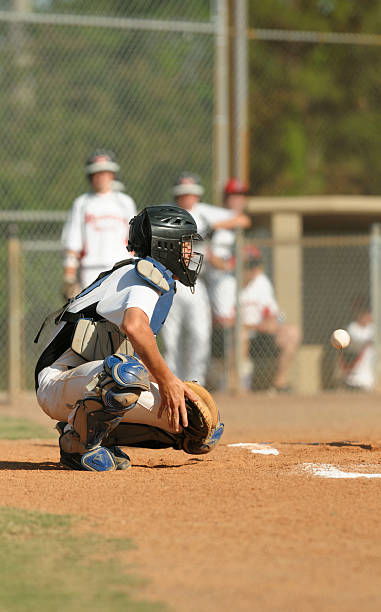 istock Baseball catcher about to catch ball 174849582