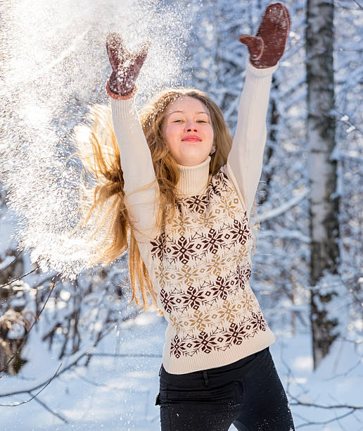 istock Beautiful girl throwing snow into air 174849849