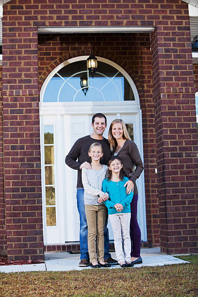 istock Family standing outside front door 174850148