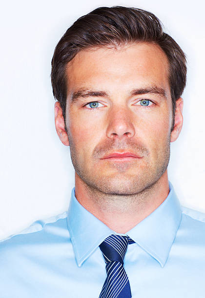 Studio headshot of a handsome young businessman isolated on white
