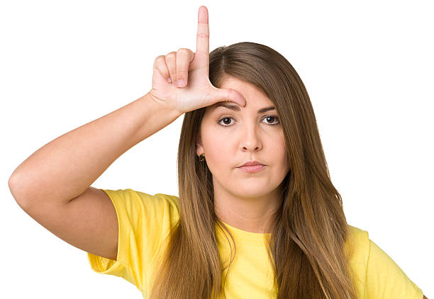 istock Young Woman Makes Loser L Hand Gesture 174851063