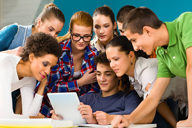 istock Group of people looking at digital tablet 174851123
