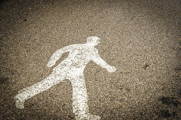 Parent and child walking hand in hand road sign