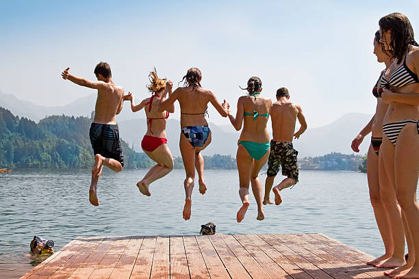istock Group jump in the water for photographers 174851175