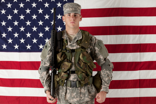 Army man standing in front of American flaghttp://www.twodozendesign.info/i/1.png