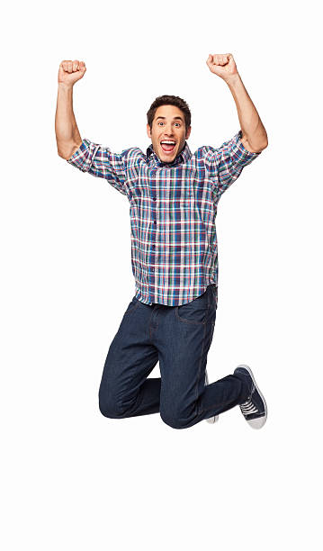 istock Ecstatic young man jumping in the air 174852015