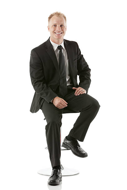 istock Happy businessman sitting on a stool 174852078