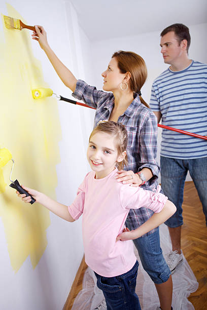 istock Happy family painting the wall. 174852282