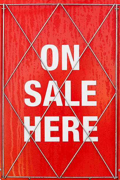 istock On Sale Here newspaper noticeboard red and white saturated 174852460