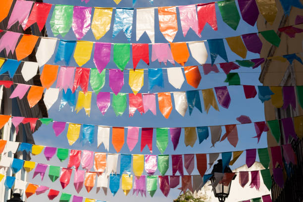 istock Festive decoration flags of different colors hanging with string. 1748525069
