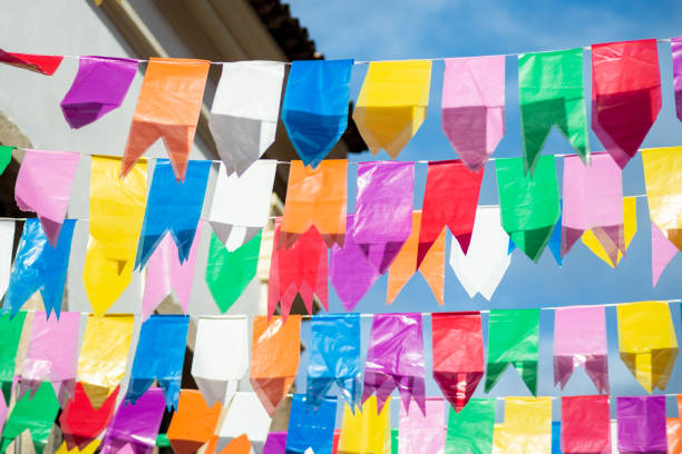 istock Festive decoration flags of different colors hanging with string. 1748525586