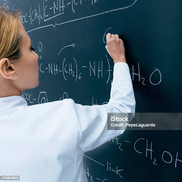 Teaching Chemistry Stock Photo - Download Image Now - 30-34 Years, Adult, Adults Only