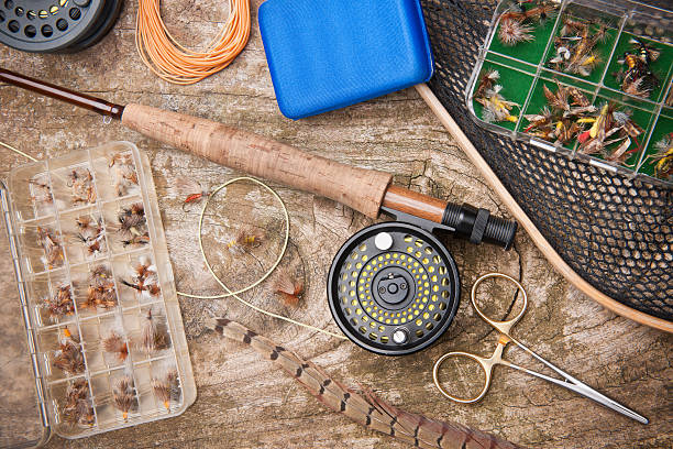 fly fishing gear - hobbies fishing net hemostat feather foto e immagini stock