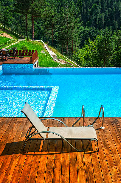 istock Empty Sun Lounger by Swimming Pool in the Mountains 174853035