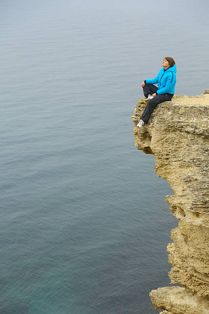 istock young woman rest on the mountain coast 174853293