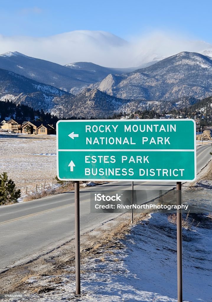 Road sign for Rocky Mountain National Park and Estes Park "The road leading into Estes Park, Colorado with the snow capped mountains of the Rocky Mountain National Park in the background." Blue Stock Photo Road sign for Rocky Mountain National Park and Estes Park "The road leading into Estes Park, Colorado with the snow capped mountains of the Rocky Mountain National Park in the background." Blue Stock Photo