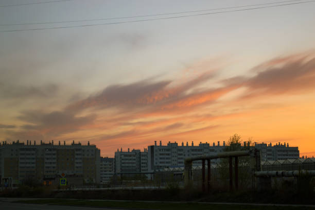 istock Multi-storey buildings at dusk and clouds in the evening sky at sunset 1748536603