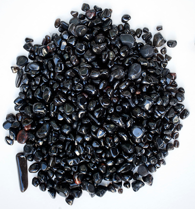 Tumbled and polished volcanic obsidian  rocks.