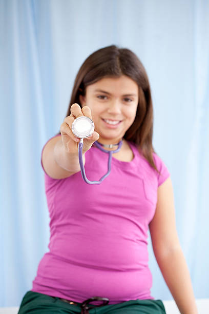 Female Doctor Holding Stethoscope