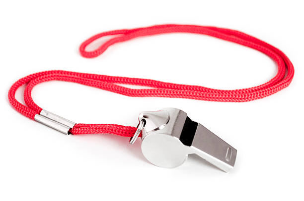 Whistle Metal whistle with red string. whistle stock pictures, royalty-free photos & images