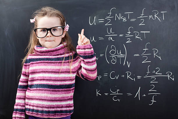 istock Girl in front of a chalkboard with complicate maths 174854182