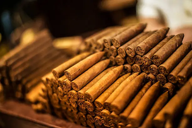 Cuban cigars on a shelf.