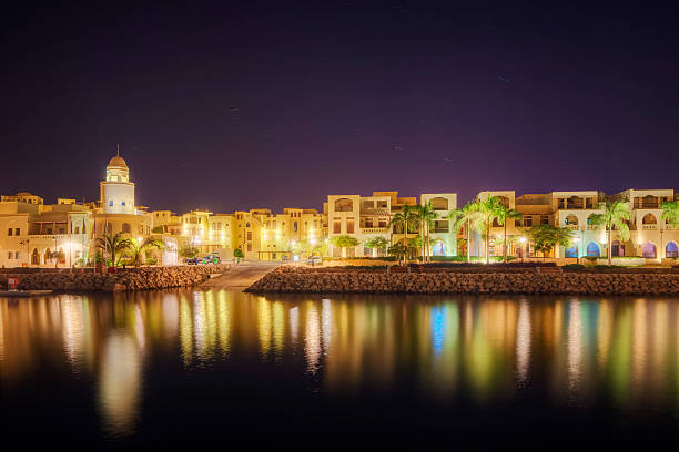 The Marina of Tala Bay - Aqaba / Jordan "The Marina of Tala Bay (Aqaba / Jordan) at night.The Marina of Tala Bay lies the 30,000-square meter Marina, an international official port that can host up to 68 yachts/boats. The Marina receives 3,000 tourists every week who come to stay at Tala Bay, or to go from it on excursions to Petra and Wadi Rum. Tala Bay Marina lies within the 27km coastline of Jordan, 14km south of the city of Aqaba, within the 7km of Aqaba Marine Park." akaba stock pictures, royalty-free photos & images