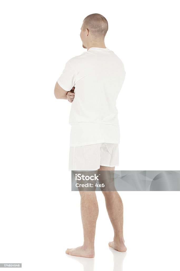 Vista traseira de um homem de pé em Roupa Interior - Royalty-free 20-29 Anos Foto de stock