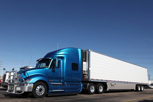 istock Numerous semi-trucks in a parking lot 174854575