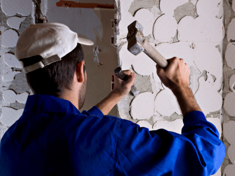 Worker using a hammer