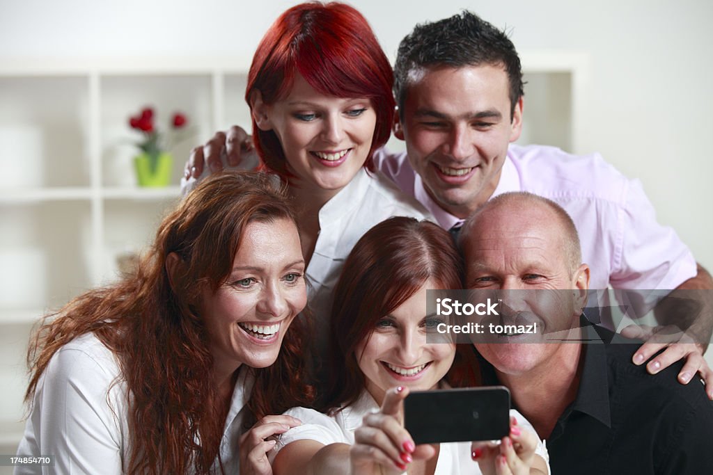 Equipe de negócios, tirando uma foto - Foto de stock de Adulto royalty-free