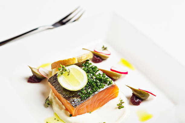 istock Looking down at gourmet dish of salmon with caper berries 174854890