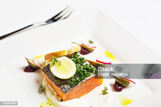 Looking Down At Gourmet Dish Of Salmon With Caper Berries Stock Photo - Download Image Now