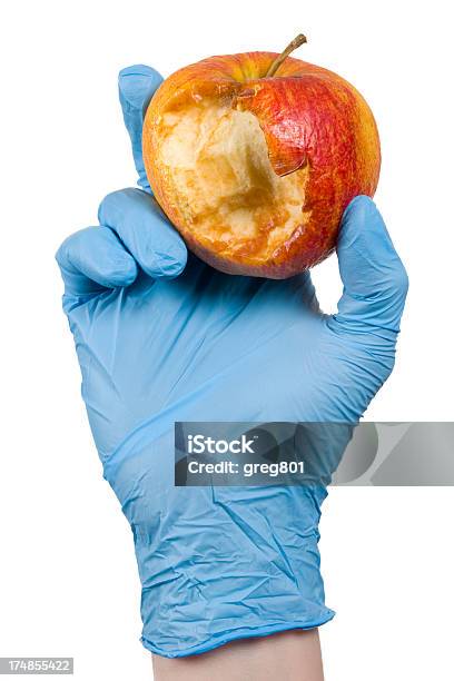 Guante Azul Sosteniendo Un Pésimo Apple Xxxl Foto de stock y más banco de imágenes de Agarrados de la mano - Agarrados de la mano, Alimentos con una mordida, Asistencia sanitaria y medicina