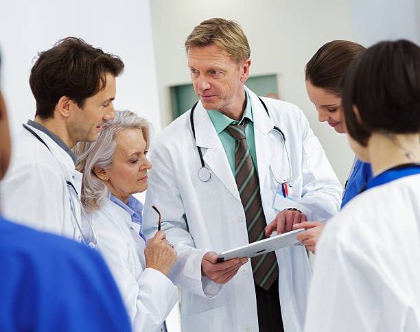istock Hospital staff talking about patient care 174855656