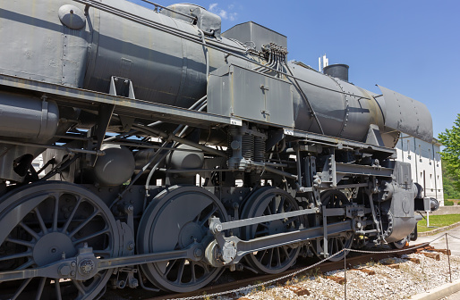 Pivka, Slovenia - June 25, 2023: Close-up on the locomotive of a military train from WWII at the Pivka Park of Military History