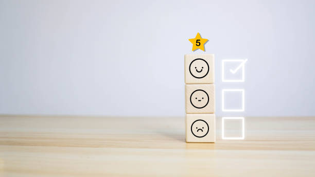 istock ustomer services best excellent business rating experience. Satisfaction survey concept. Hand of a businessman chooses a smiley face on wood block cube. 5 Star Satisfaction 1748568330