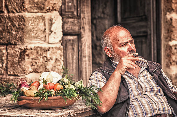 Senior farmer man smoking cigar