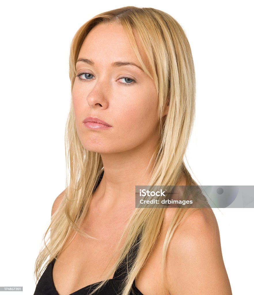Young Woman Looking At Camera With Attitude Portrait of a young woman, isolated on a white background. 20-29 Years Stock Photo