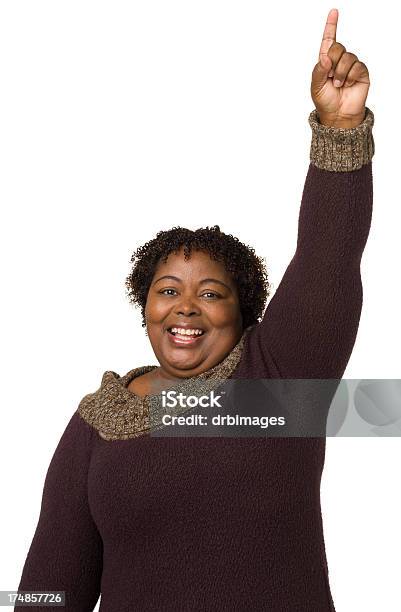 Happy Mature Woman Raises One Finger Stock Photo - Download Image Now - Number 1, Number One Finger Sign, Women