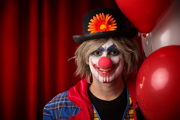 istock Creepy Clown carrying balloons 174857756