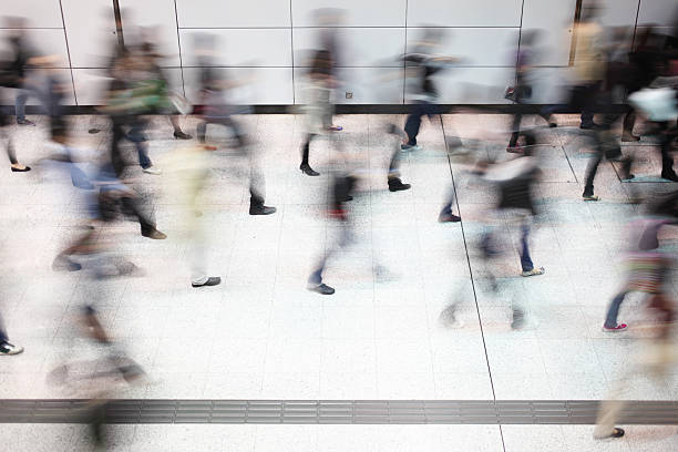 istock Busy Commuters Walking in Subway Station Motion Blur 174857858