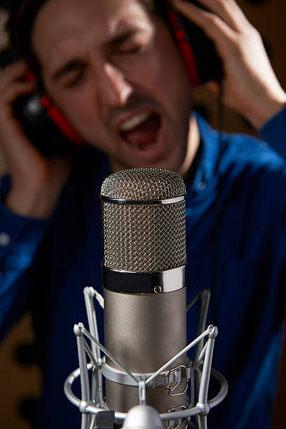istock Male Vocalist In Recording Studio 174858582