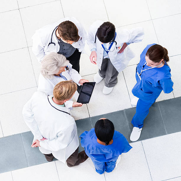 istock Group of Doctors Discussing Results 174858830