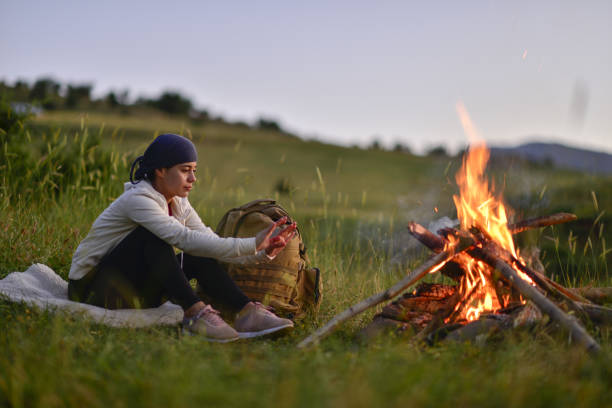 istock young female mountaineer camping 1748588368